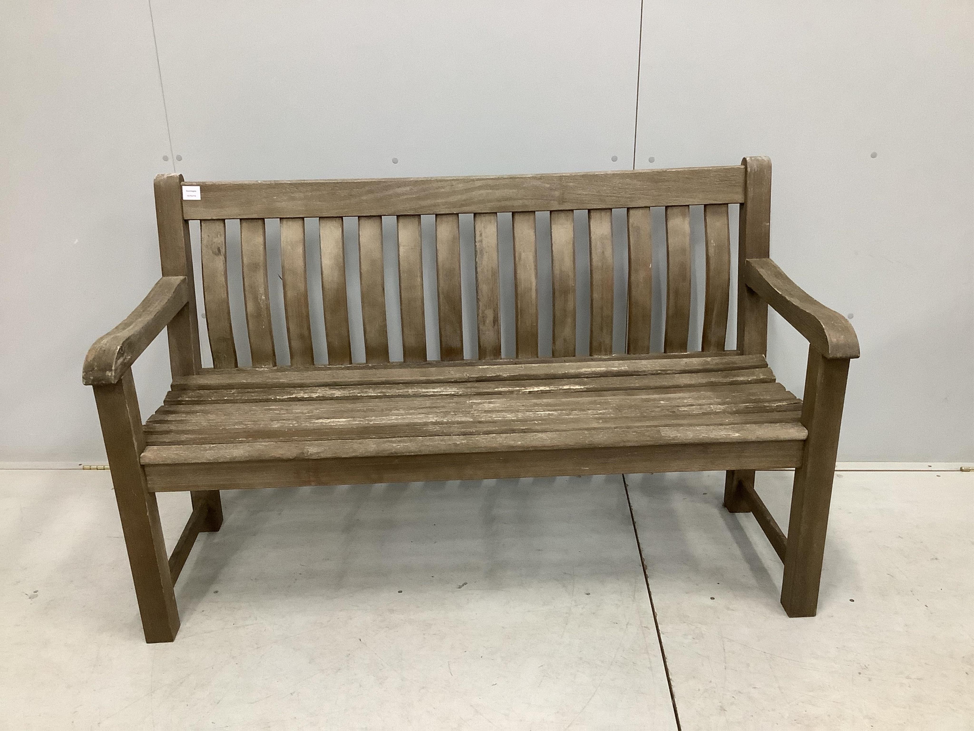 A weathered teak slatted garden bench, width 146cm, depth 52cm, height 92cm. Condition - good but weathered